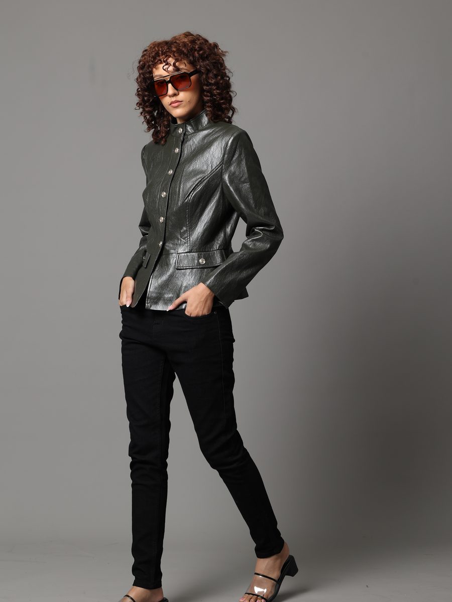 Model in a leather jacket wearing Ice sunglasses with amber lenses