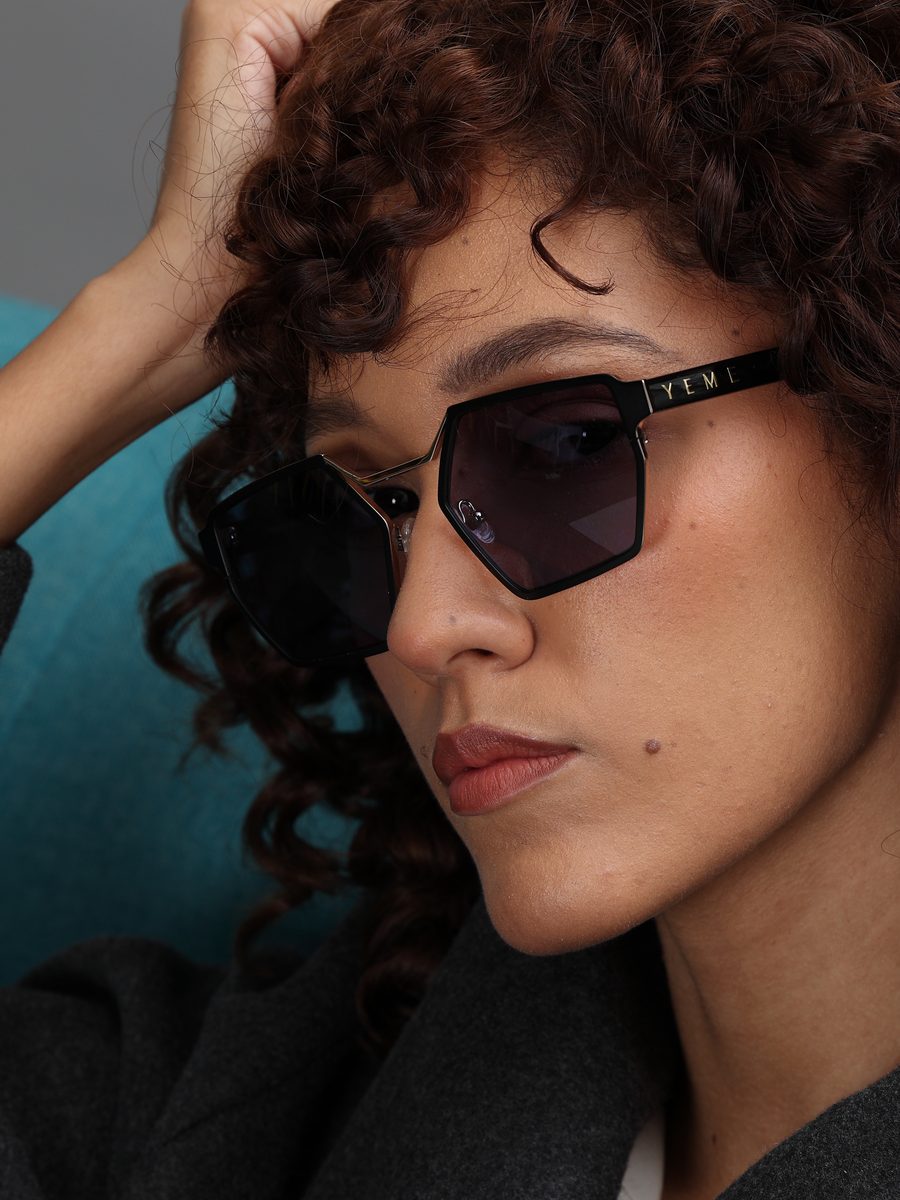 Close-up of Venom hexagon sunglasses with violet lenses